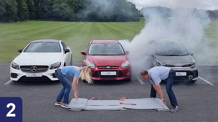 Electric vehicle fire blanket deployment