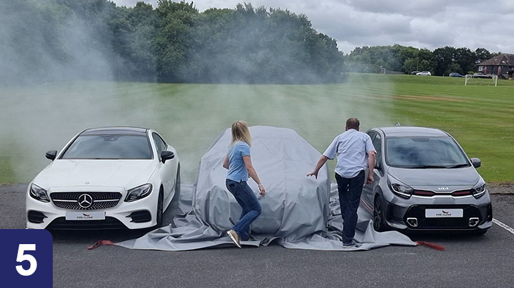 Electric vehicle fire blanket deployment